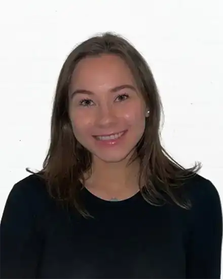 Professional woman smiling, promoting effective communication skills and coaching services.