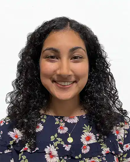Teen girl smiling, promoting communication skills coaching for teens and adults.