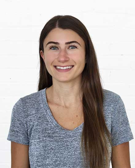 Woman smiling, communication skills coaching, professional development, success.