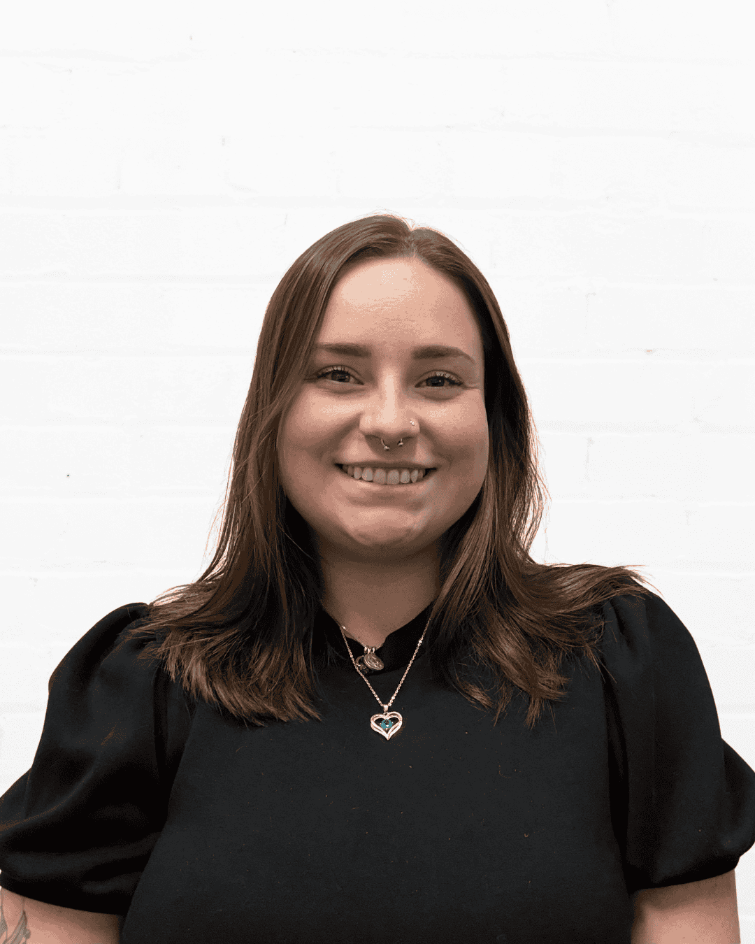 Woman smiling, promoting communication skills and coaching services at All About Communication.